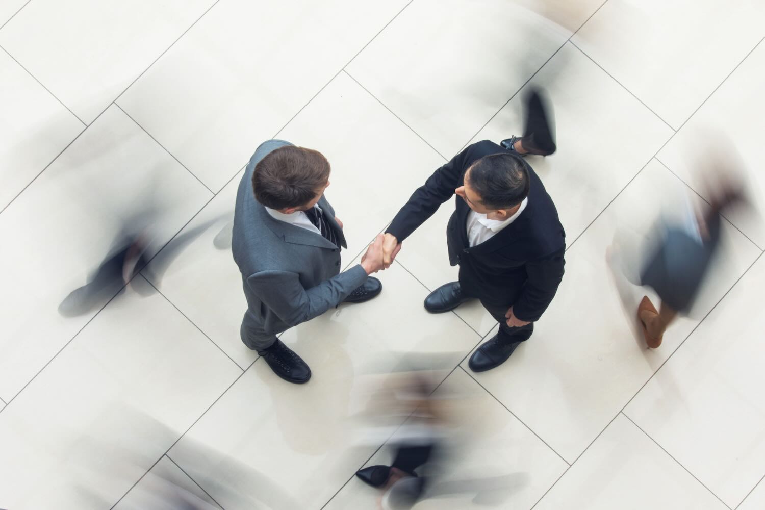Photo from above of two people shaking hands